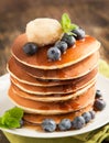 Stack of pancakes with fresh blueberry,maple butter and syrup Royalty Free Stock Photo