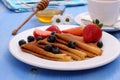 Stack of pancakes, fresh strawberry blueberry and honey