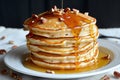 stack of pancakes with honey drizzle and nuts, side view Royalty Free Stock Photo