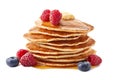 Stack of pancakes with maple syrup and fresh berries on white Royalty Free Stock Photo