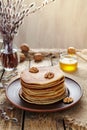 Stack of pancakes with nuts on vintage wooden table Royalty Free Stock Photo