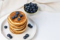 Stack of pancakes on plate with blueberries, top view Royalty Free Stock Photo