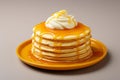 a stack of pancakes on a plate with syrup and whipped cream Royalty Free Stock Photo