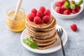 Stack of pancakes with raspberries