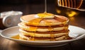 Stack of Pancakes With Syrup Being Drizzled