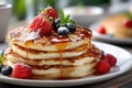 Stack of pancakes with syrup, berries, and mint Royalty Free Stock Photo