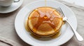 Stack of Pancakes with Syrup and Fork on White Plate Royalty Free Stock Photo