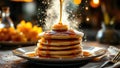 Stack of pancakes with syrup pour at cozy breakfast setting Royalty Free Stock Photo