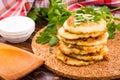 A stack of pancakes of zucchini and parsley