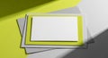 Stack of paper cards with a blank white card on a lime green and grey background image Royalty Free Stock Photo