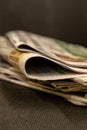 Stack of paper newspapers periodicals morning correspondence a news source and plexus close-up edge