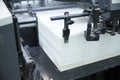 Stack of paper in a printing press. Royalty Free Stock Photo