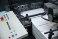 Stack of paper in a printing press. Royalty Free Stock Photo
