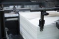 Stack of paper in a printing press. Royalty Free Stock Photo