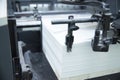 Stack of paper in a printing press. Royalty Free Stock Photo