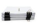 Stack of papers with clips isolated on white background Royalty Free Stock Photo
