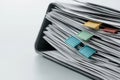 A stack of papers with colorful paper clips on top of them Royalty Free Stock Photo