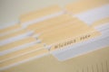 A stack of papers in filing cabinet with inscription Royalty Free Stock Photo