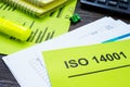 Stack of papers about ISO 14001 in the office. Royalty Free Stock Photo