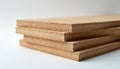 Stack of particle boards isolated on white background. Light brown compressed wood material with visible grain texture. Boards Royalty Free Stock Photo