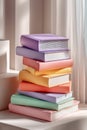 Stack of pastel-colored books beautifully displayed with soft light enhancement Royalty Free Stock Photo