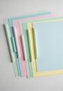 A stack of pastel-colored file folders arranged in an overlapping manner. The folders Royalty Free Stock Photo