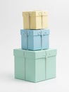 Stack of pastel colored gift boxes with ribbons isolated on white background Royalty Free Stock Photo