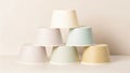 Stack of pastel colored paper cups arranged artfully minimalist aesthetic for beverage service or event decor Royalty Free Stock Photo