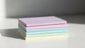 Stack of pastel colored sticky notes arranged in a neat pile Royalty Free Stock Photo