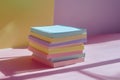 Stack of pastel colored sticky notes on a complementary background creating a playful mood Royalty Free Stock Photo