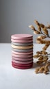 Stack of pastel colored wooden discs with dried flowers Royalty Free Stock Photo