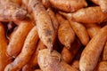 Stack of patate carottes on a market stall Royalty Free Stock Photo