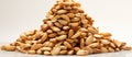 A stack of peanuts, a plant seed, on a white surface Royalty Free Stock Photo