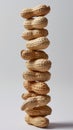 Stack of peanuts in shells, balancing composition. Healthy snack and food concept Royalty Free Stock Photo