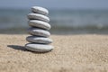 Stack of pebble stones on balance on sand Royalty Free Stock Photo