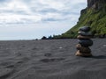 Stack of pebble stones at the black sand beach in the south of Iceland Royalty Free Stock Photo