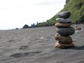 Stack of pebble stones at the black sand beach in the south of Iceland Royalty Free Stock Photo