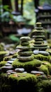 Stack of pebbles covered with moss