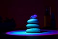 Stack of pebbles with flower, relax calm concept. Ultraviolet background