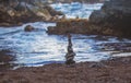 Stack of pebbles stone against sea background for spa, balance, meditation and zen theme. Royalty Free Stock Photo