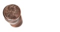 Stack of Pennies on White Background representing savings and wealth