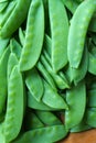 Stack of picked grean peas in pods