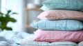 a stack of pillows. pillowcases in pastel blue, pink, mint colors with small checks and stripes on a white background of