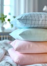 a stack of pillows. pillowcases in pastel blue, pink, mint colors with small checks and stripes on a white background of Royalty Free Stock Photo