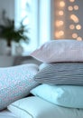 a stack of pillows. pillowcases in pastel blue, pink, mint colors with small checks and stripes on a white background of