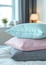 a stack of pillows. pillowcases in pastel blue, pink, mint colors with small checks and stripes on a white background of Royalty Free Stock Photo