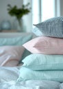 a stack of pillows. pillowcases in pastel blue, pink, mint colors with small checks and stripes on a white background of Royalty Free Stock Photo