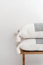 stack of pillows on wood table in stylish apartment Royalty Free Stock Photo