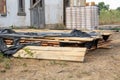 A stack of pine boards soaked in an antiseptic solution is dried at the construction site Royalty Free Stock Photo