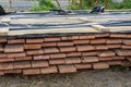 A stack of pine boards soaked in an antiseptic solution is dried at the construction site. Royalty Free Stock Photo